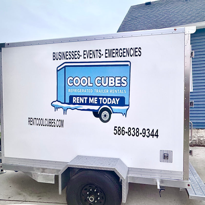 A Cool Cube trailer parked on the side of the road